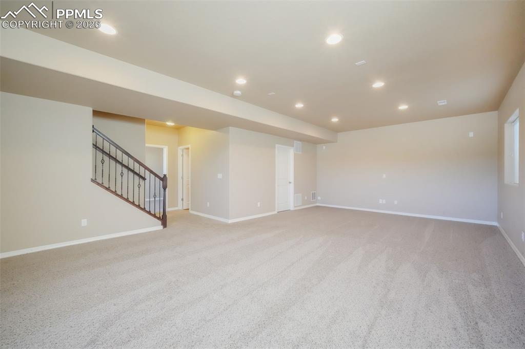 Basement family room, access to storage and mechanical room