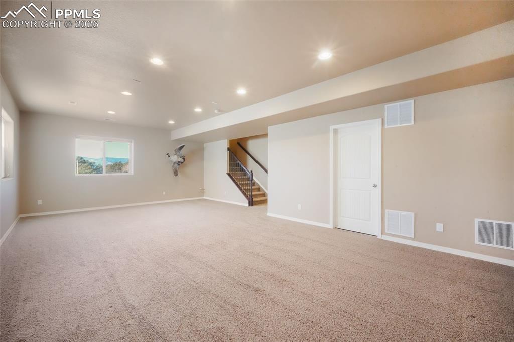 Basement family room, access to storage and mechanical room