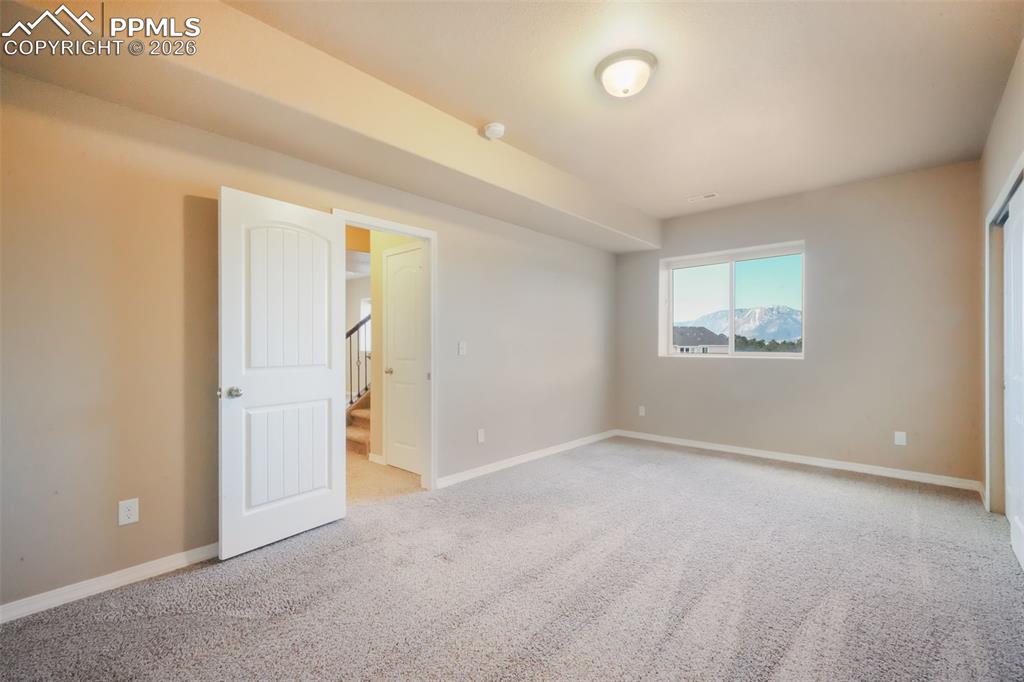 Basement fifth bedroom with mountain views and walk in closet