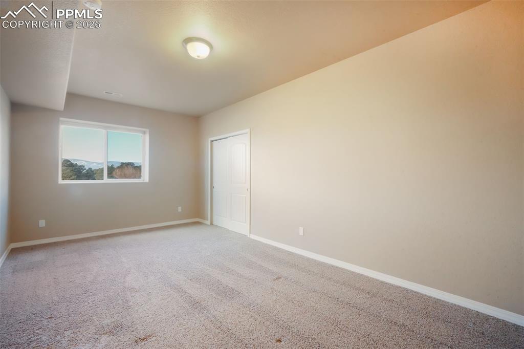 Basement fifth bedroom with mountain views and walk in closet