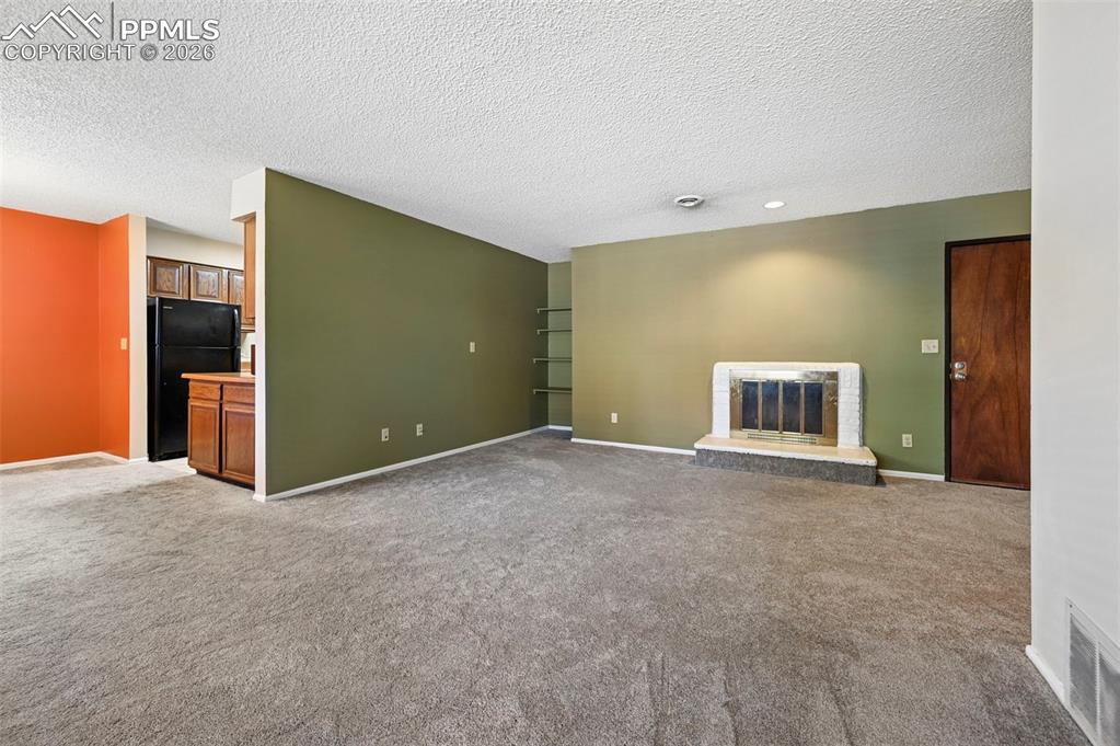 Living room looking into dining room and kitchen 