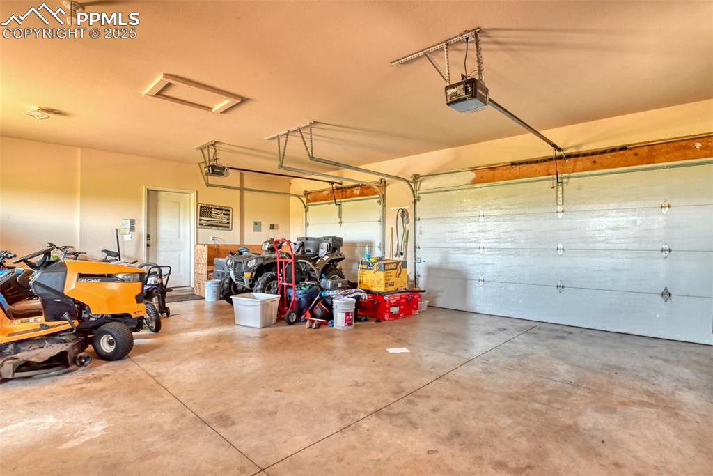 Garage featuring a garage door opener