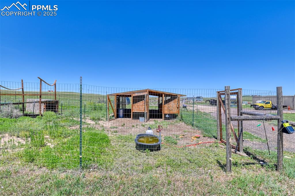 View of yard with exterior structure and an outdoor structure
