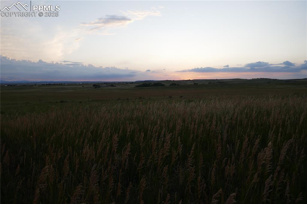 View of mountain backdrop featuring rural landscape
