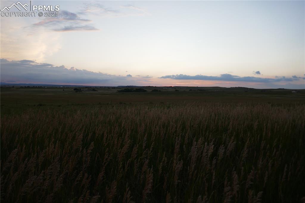 View of mountain background featuring rural landscape