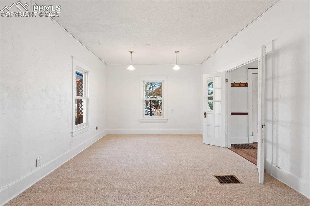 Large Primary Bedroom in Main home with Andersen windows. New Carpet 2025!