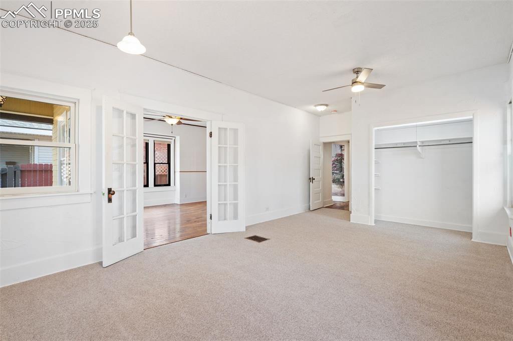 Large Primary Bedroom in Main home with Andersen windows. New Carpet 2025!