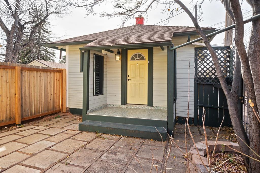 Front of cottage with patio and covered ront porch