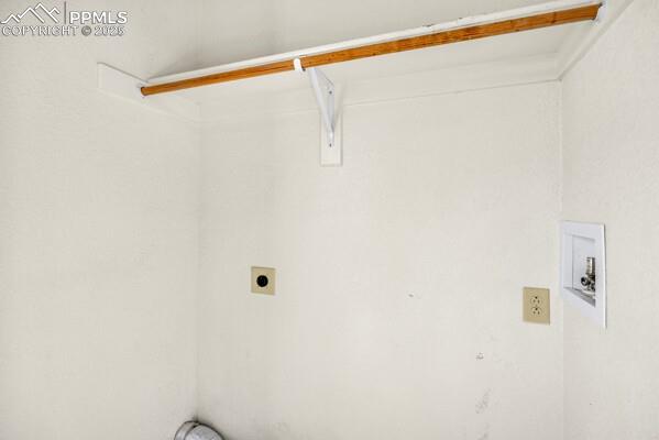 Washroom featuring hookup for an electric dryer and hookup for a washing machine