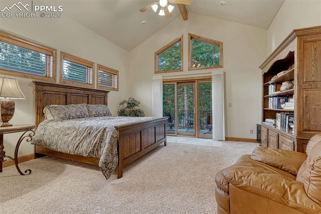 Upstairs bedroom with private balcony and attached to bathroom with walk-in closet.