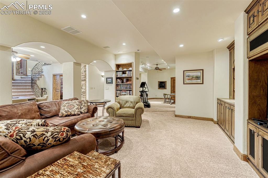 A versatile lower level with custom built-ins and a media-ready space ideal for entertaining or movie nights.