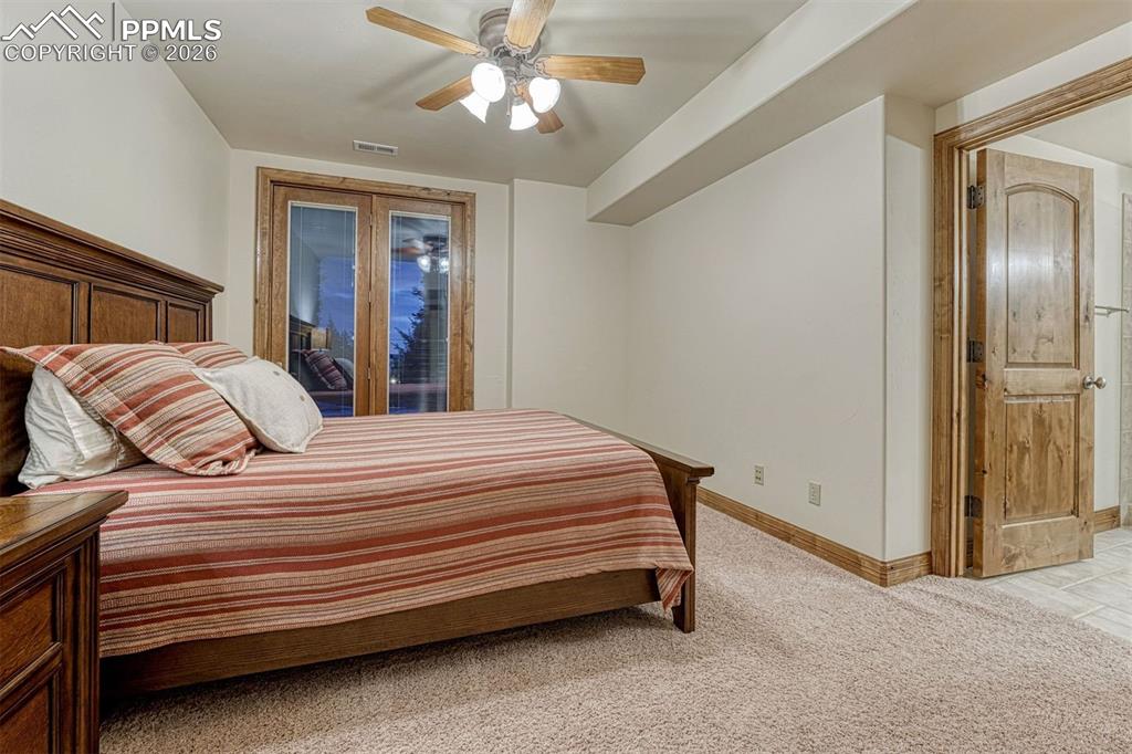 Second lower level bedroom with walk out and private bathroom.