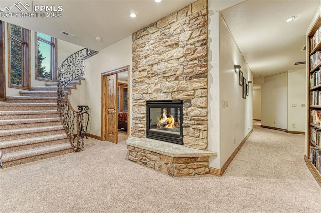 A sunlit stairway gracefully connecting to the lower level