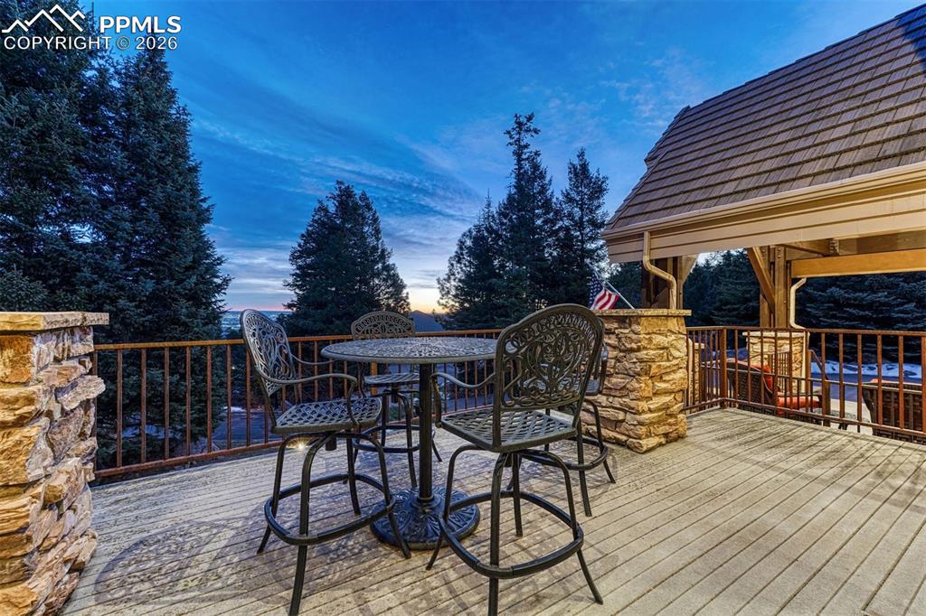 Living room deck offering serene mornings and sparkling city lights by night.