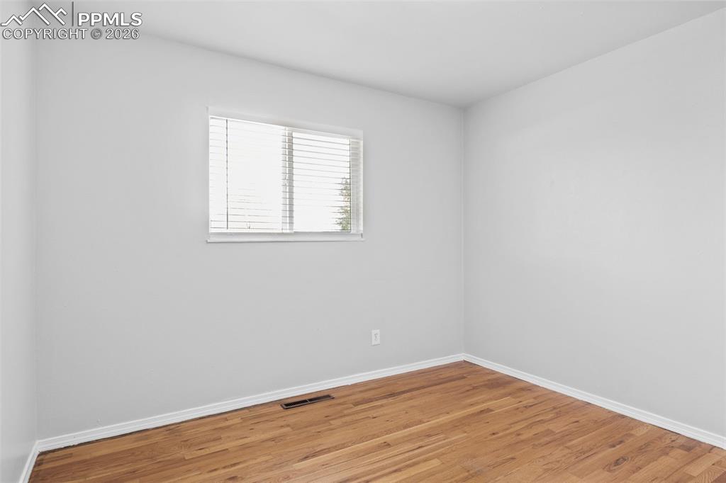 Bedroom featuring baseboards and light wood-style floors