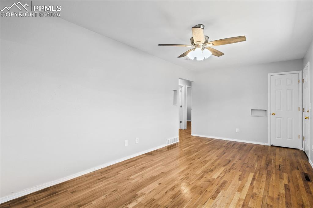 Unfurnished room with light wood-style flooring and ceiling fan