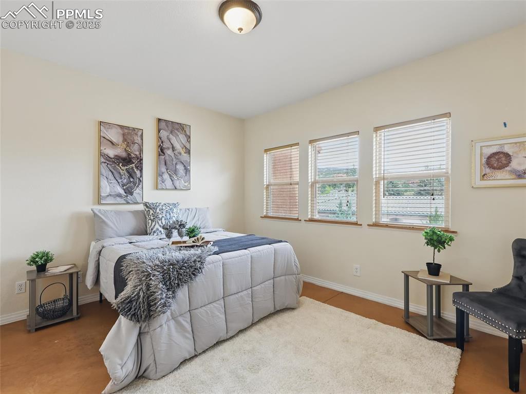 Bedroom featuring baseboards