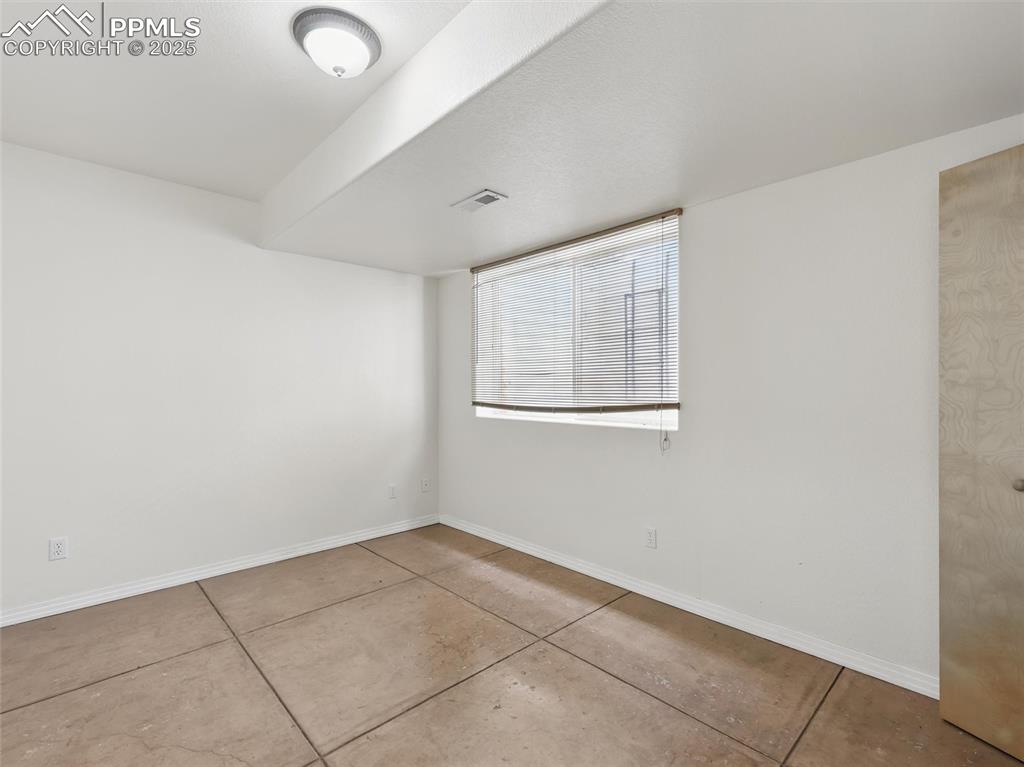 Empty room with baseboards