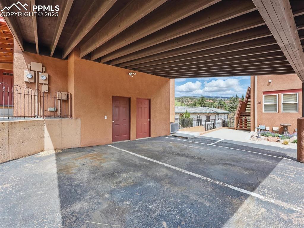 Garage featuring covered parking