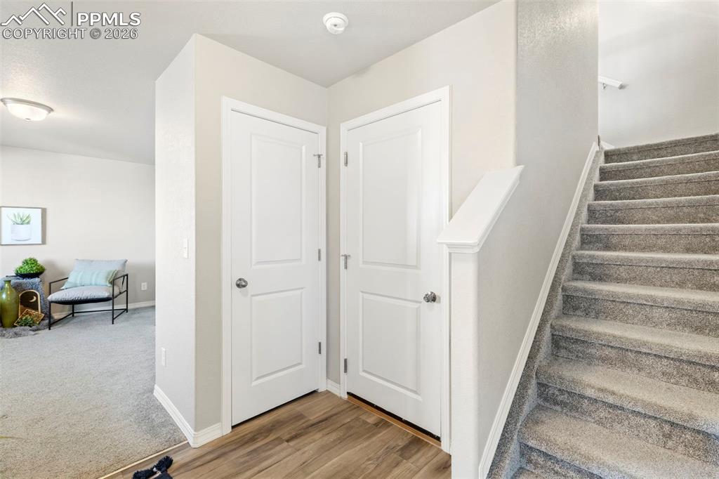 Front entryway with hallway closet and flex room/office.