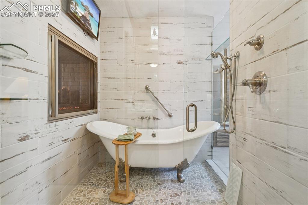 Shower and soaking tub spa bath with fireplace and tv!