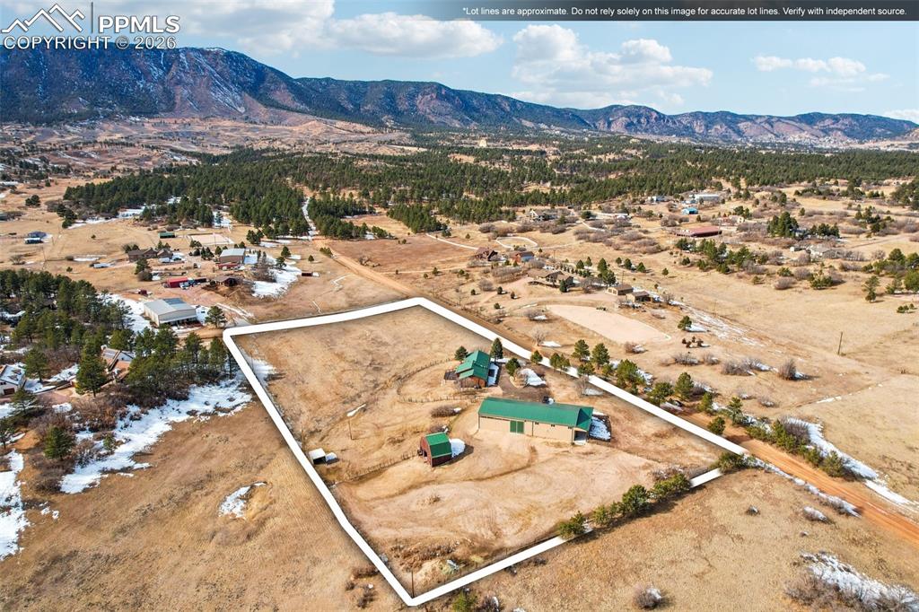 Overview of rural landscape with a mountainous background and a desert landscape