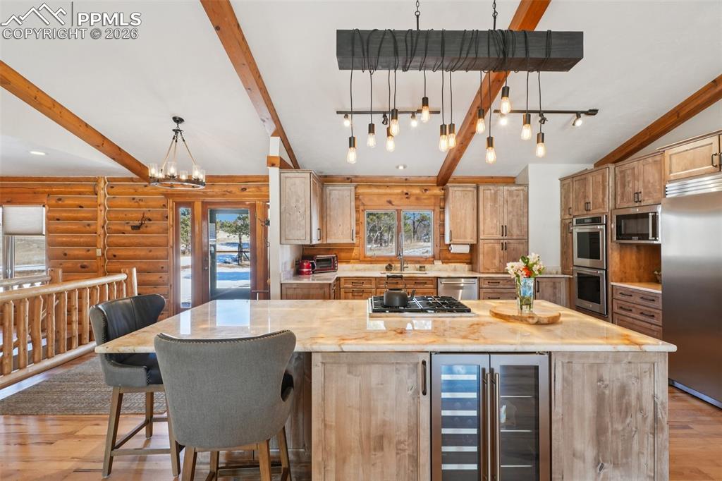 Alder custom cabinets, quartzite countertops, huge lighted island