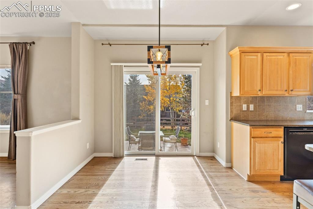 Enjoy family meals in this spacious dining area AND entertain large gatherings on special occasions. Step outside to dine on the patio.