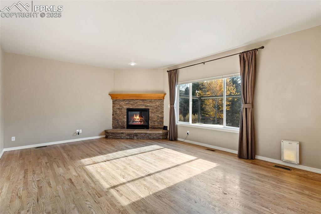 Site finished oak floors grace this wonderful living room that is adjacent to the kitchen/dining area.