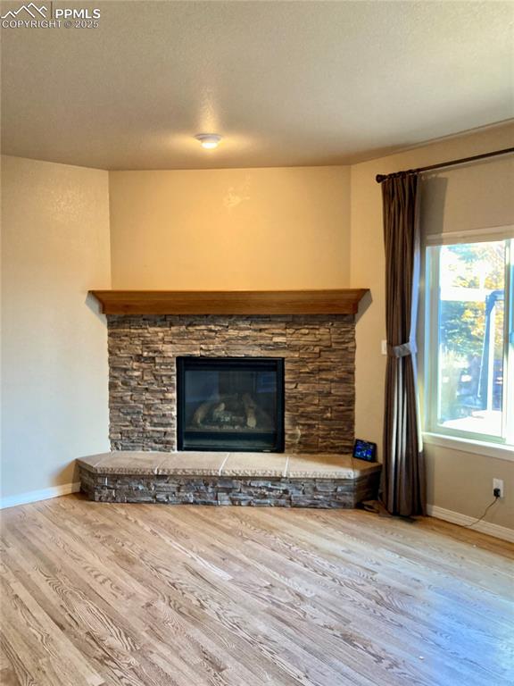 The focal point of the living room is an attractive gas fireplace with stone surround. Cuddle up in front of a warm fire on those cold Colorado days.