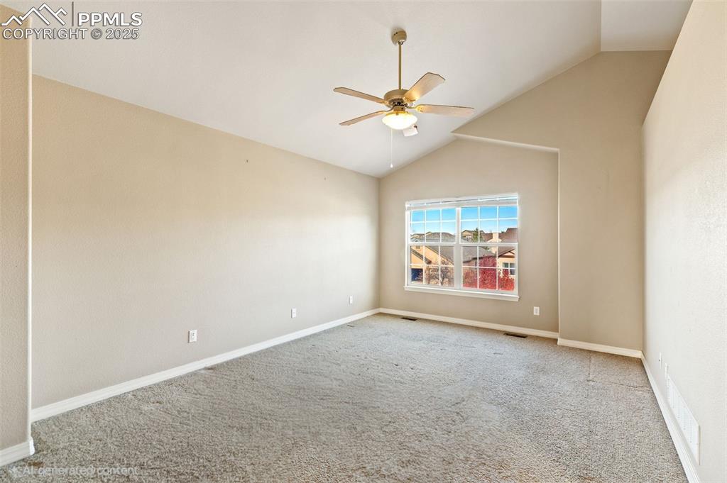 Spacious primary suite includes this spacious bedroom with vaulted ceilings and French door entry, 5-pc bath and huge walk-in closet.