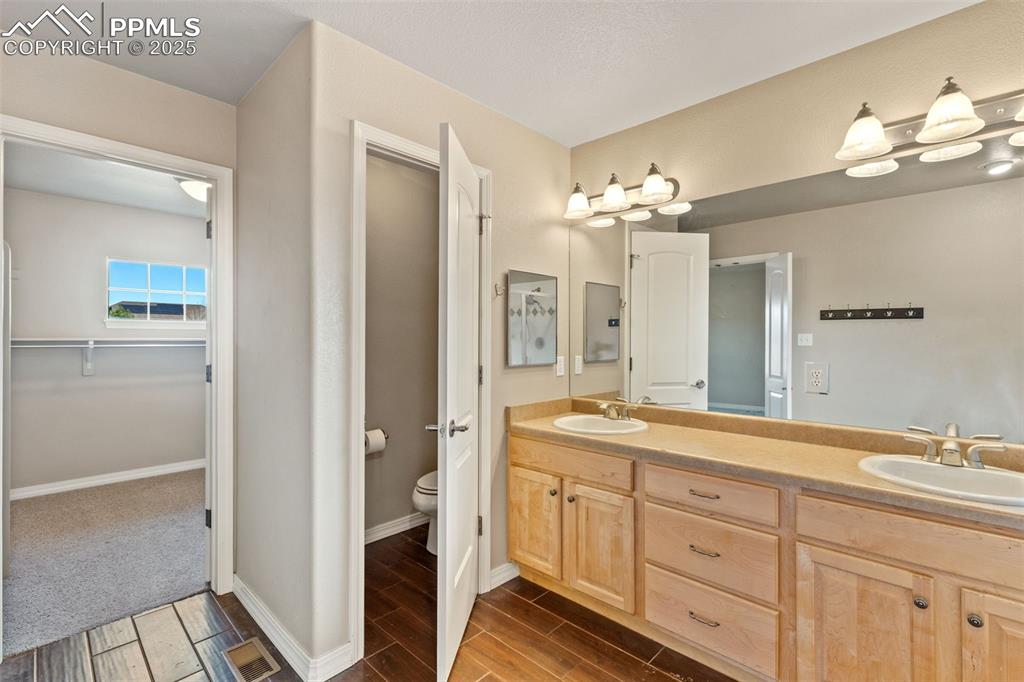The primary bath offers entry to a huge walk-in closet.