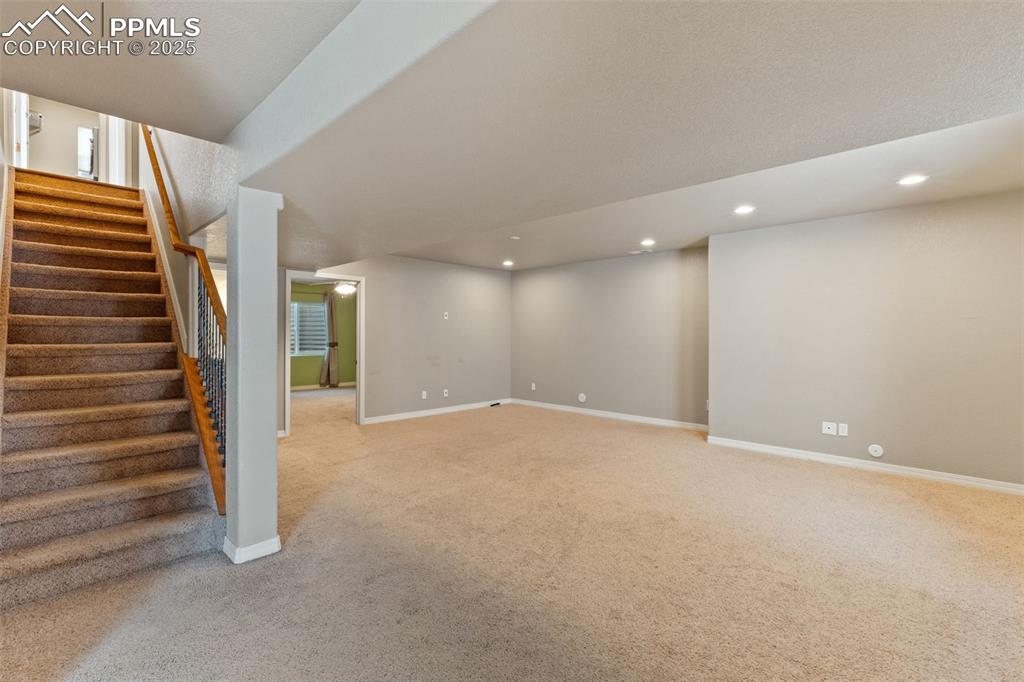The expansive basement family room has plenty of room for your pool table with lots of additional space for a theater area and other activities.