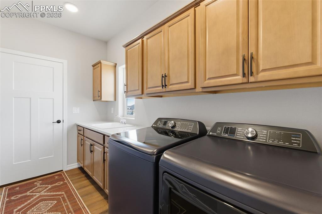 Notice All The Cabinet Space & Double Sink In The Main Level Laundry Room