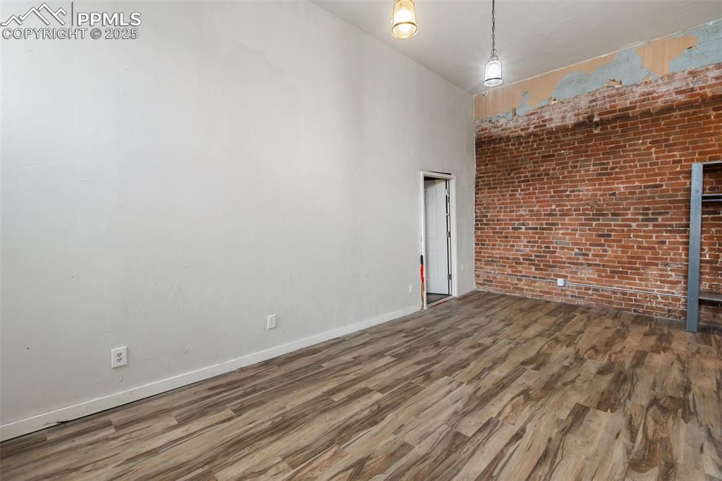 Family room with exposed historic brick wall