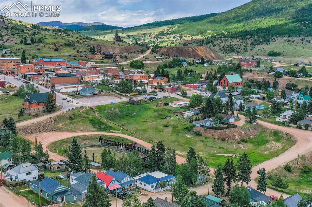 Aerial perspective of suburban area with a mountainous background