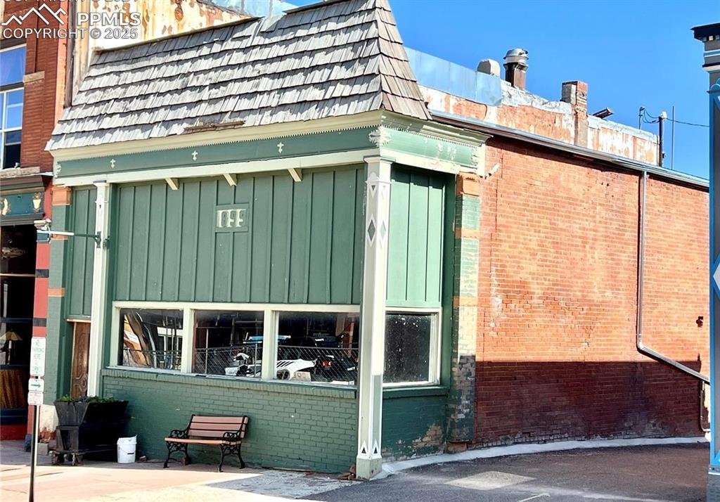 Street-facing exterior with wide display windows and Victor’s historic main street presence.