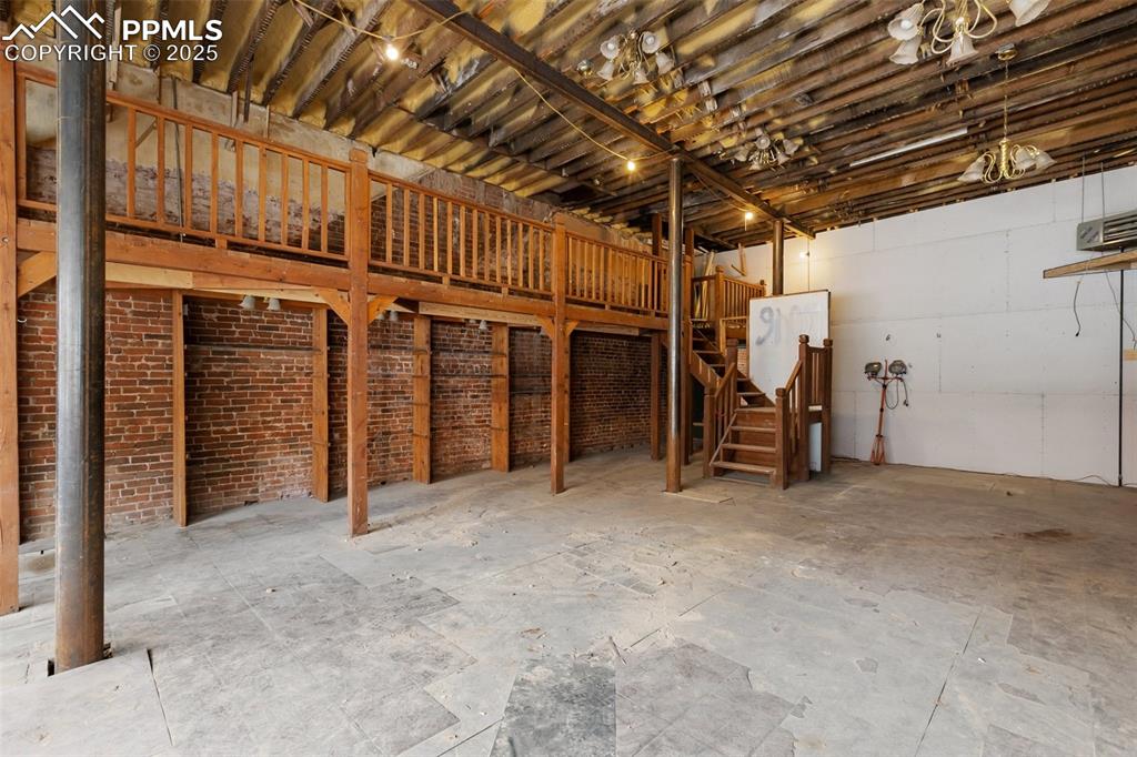 Unfinished interior with structural steel reinforcement and open floor plan