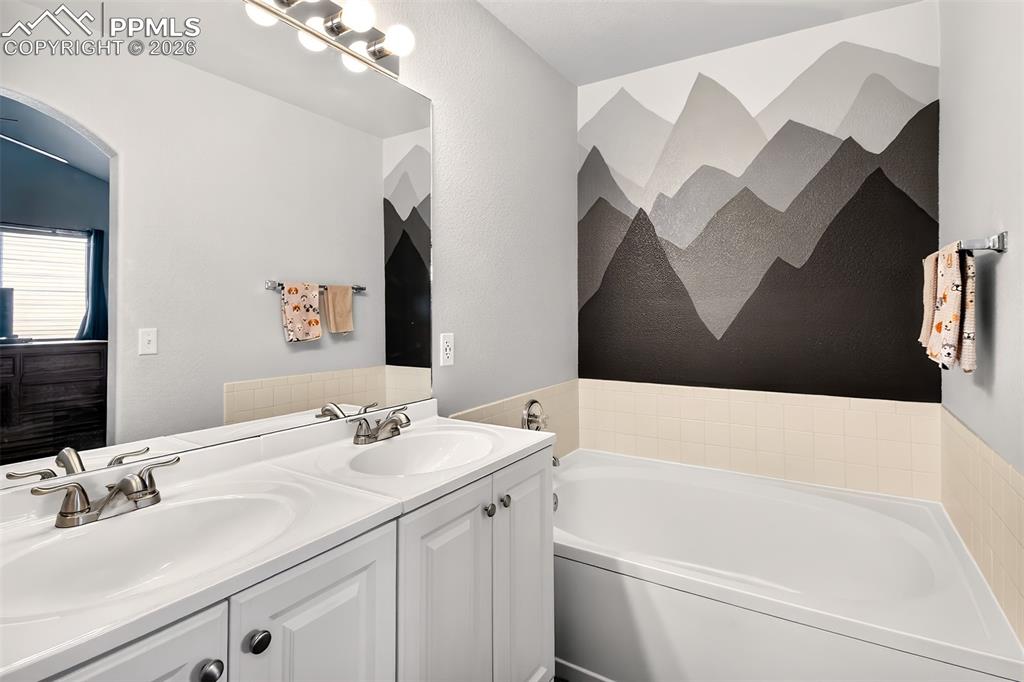 5 piece primary bathroom highlighting the soaking tub