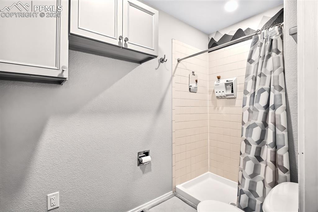 Stand in shower in the 5 piece primary bathroom