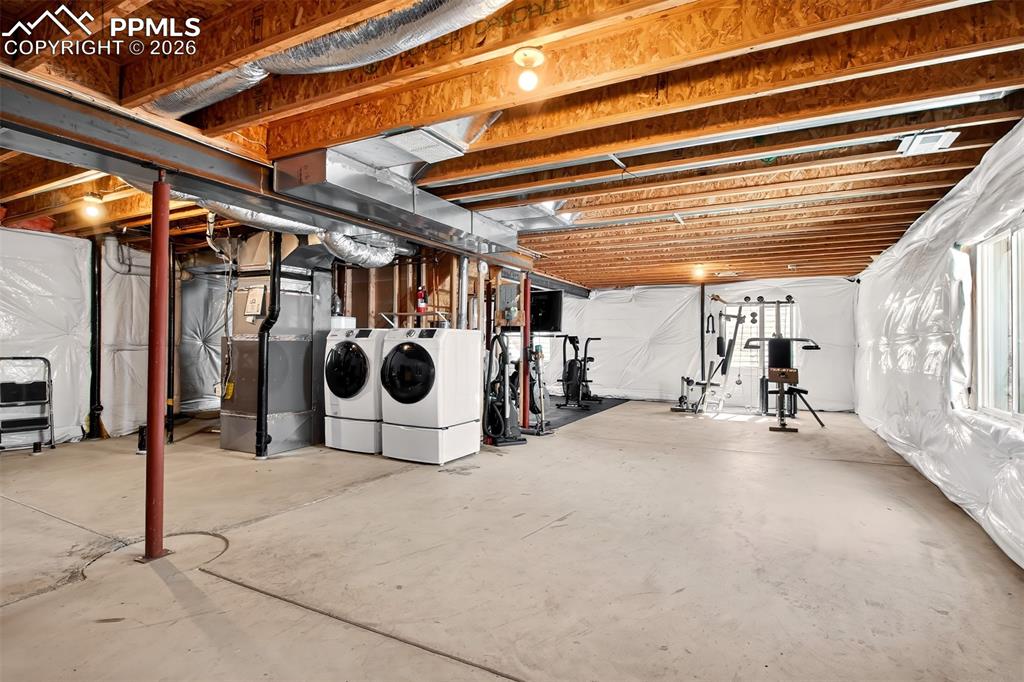 Unfinished basement with laundry