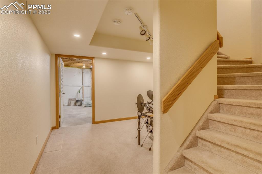 Staircase featuring carpet floors and recessed lighting