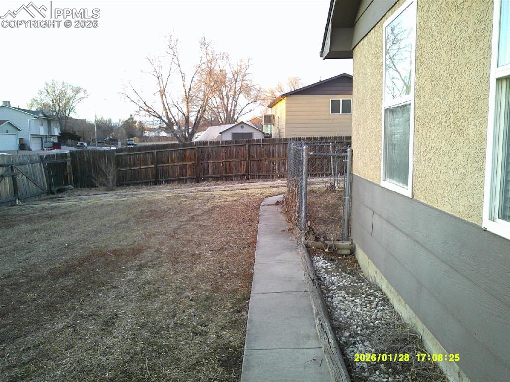 View of fenced backyard