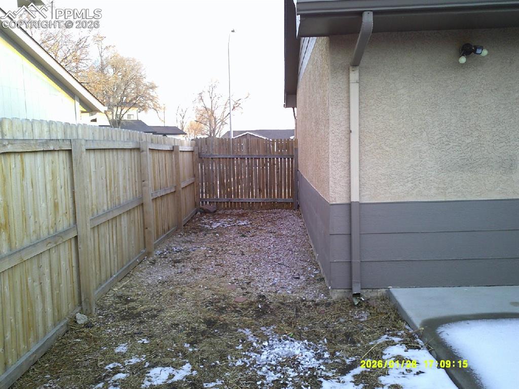 View of fenced backyard