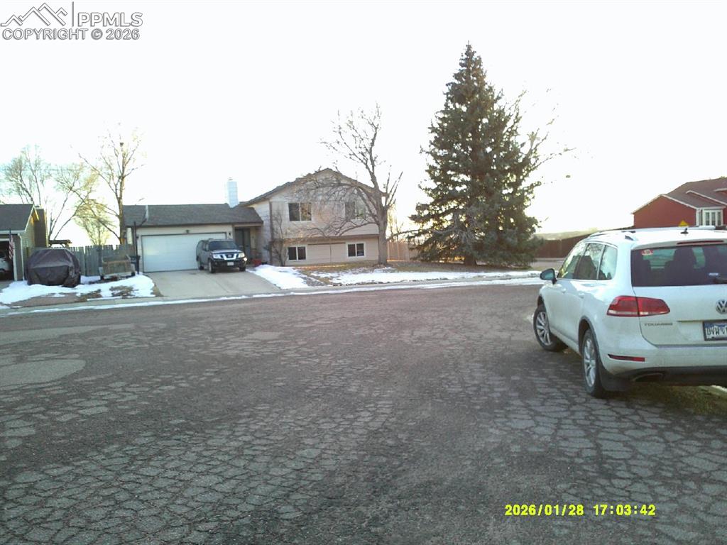View of asphalt street with sidewalks and curbs
