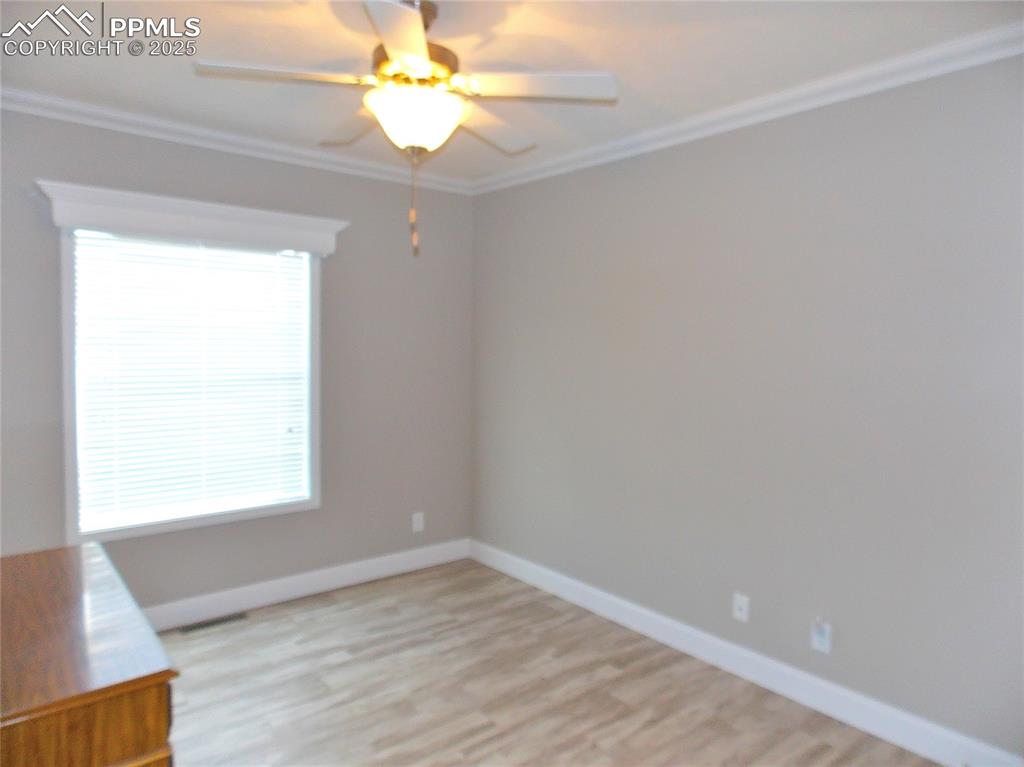 Bedroom 3 with crown molding and Fan/light