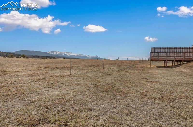 View of yard featuring a mountain view and a rural view