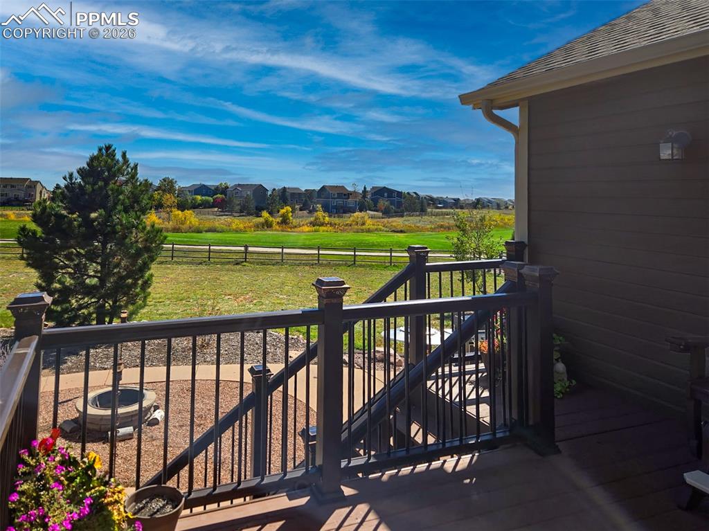 View of wooden balcony with a residential view and a deck