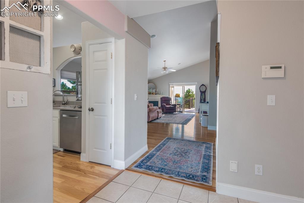 Entry way opening to great room with fire place, adjacent dining area and spacious kitchen.