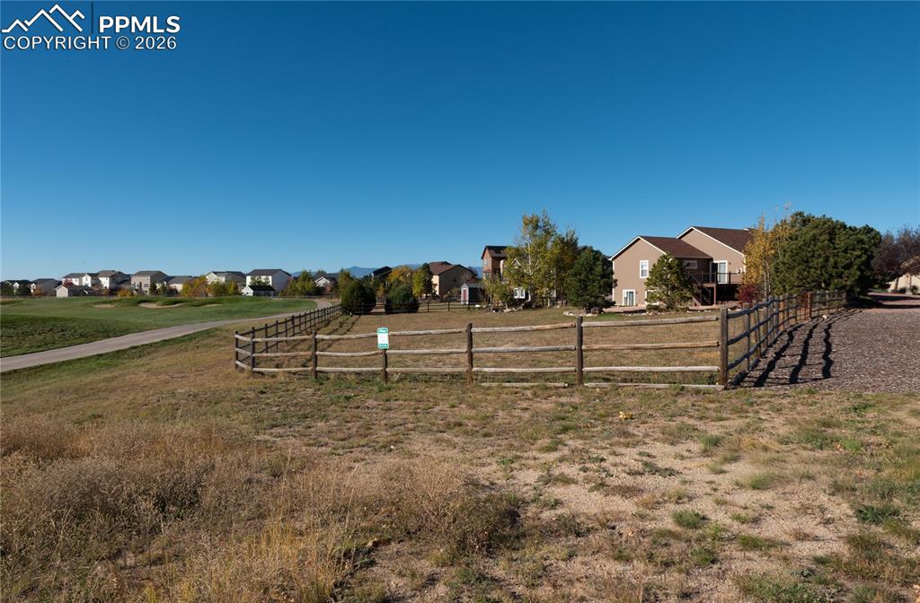 View of backyard, backing to Antler Creek Golf Course
